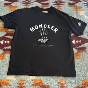 Moncler Men’s Tag says Large fits like med Black Tee with logo graphic
